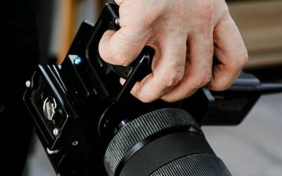 Detail shot of hands gripping a barbell handle